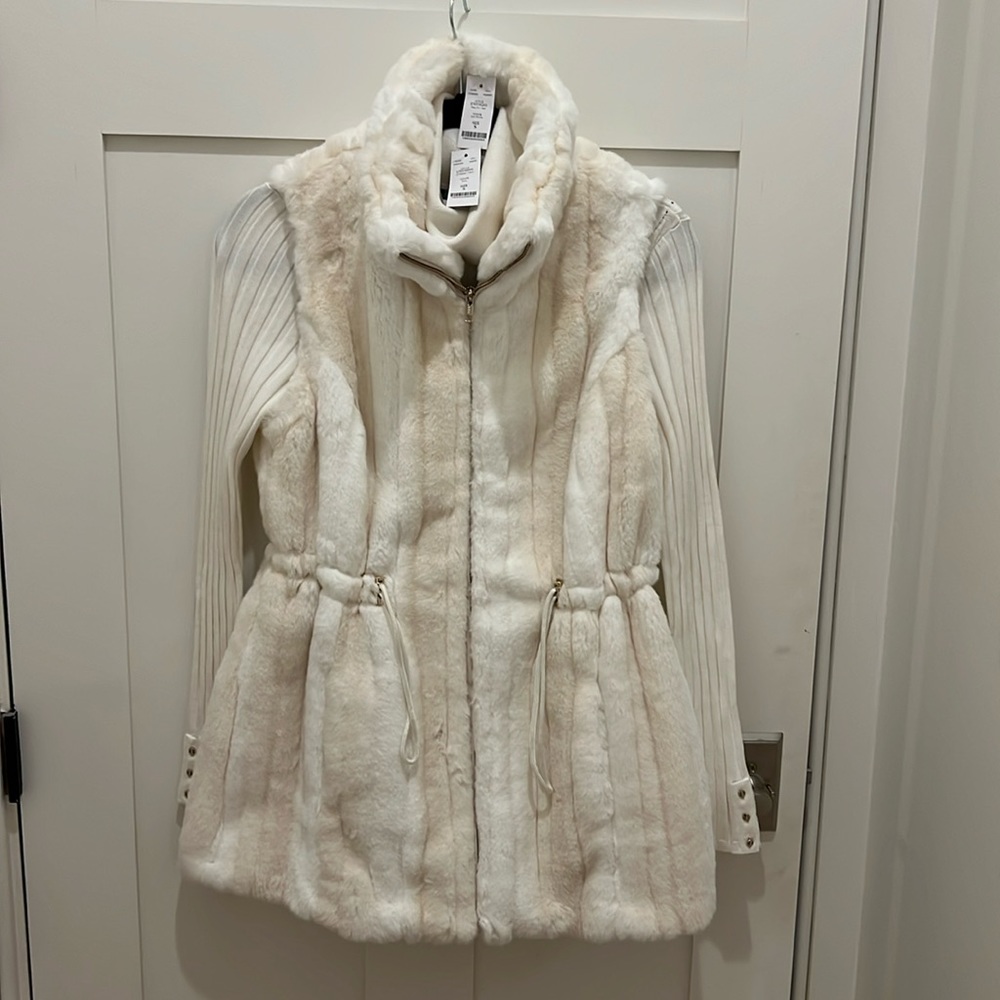 White House Black Market Creme fur vest with turtleneck.
